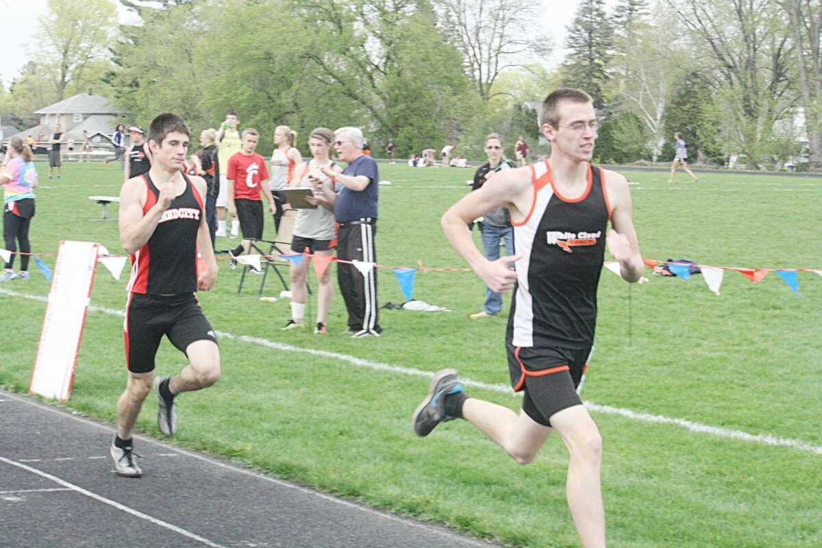 In the Race: Adam Kehr (left) finishes his race last week in the 800 (Herald Review photo/John Raffel)