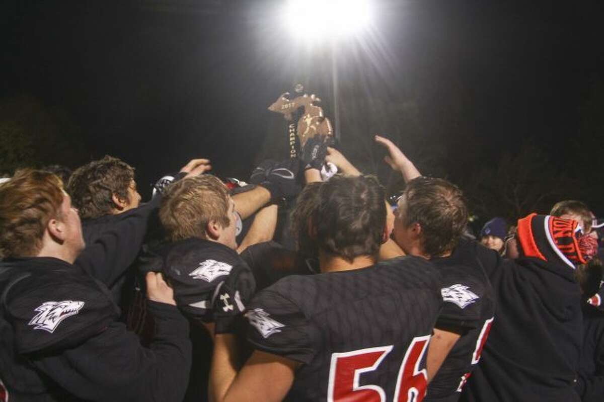 Reed City celebrates winning a district trophy
