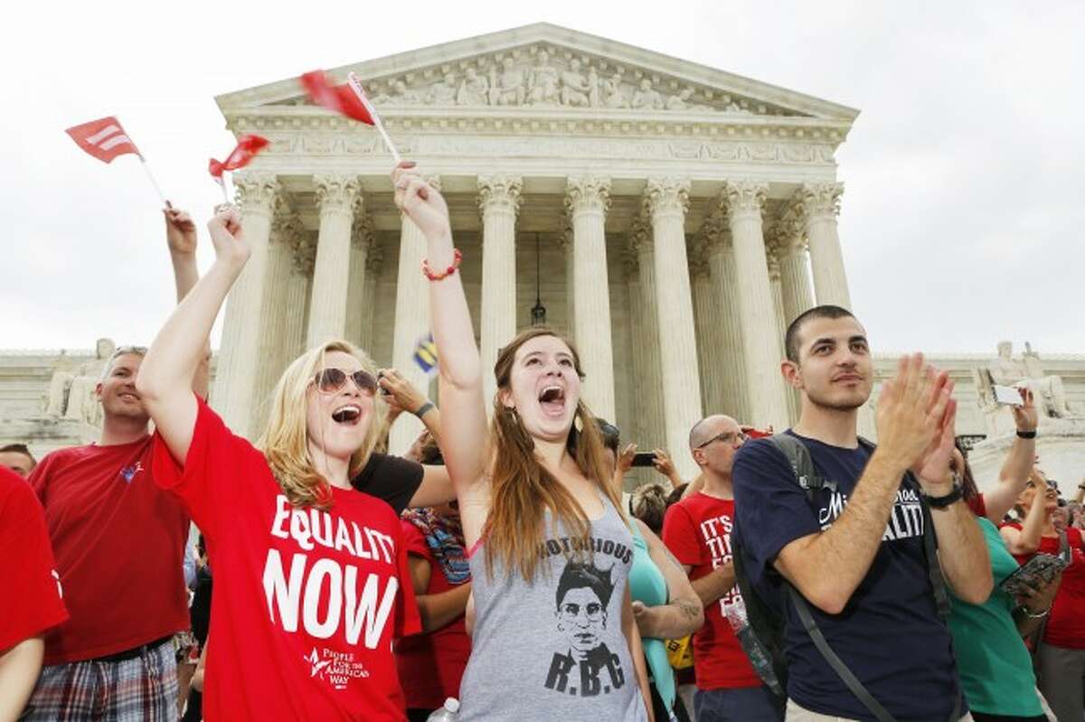 Supporters of gay marriage celebrate outside the Supreme Court on Friday, June 26, 2015 in Washington, D.C. The U.S. Supreme Court struck down bans on same-sex marriage in a historic 5-4 ruling. (Oliver Contreras/Zuma Press/TNS)