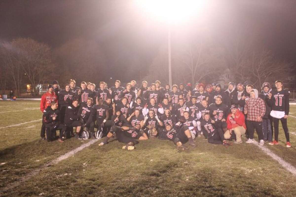 Reed City players celebrate a regional crown.