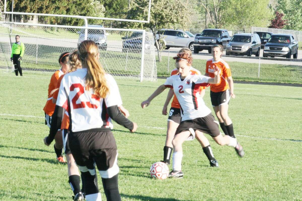 Soccer: RayAnne Shelden (2) works for the ball against Ludington last week. (Herald Review photo/John Raffel)