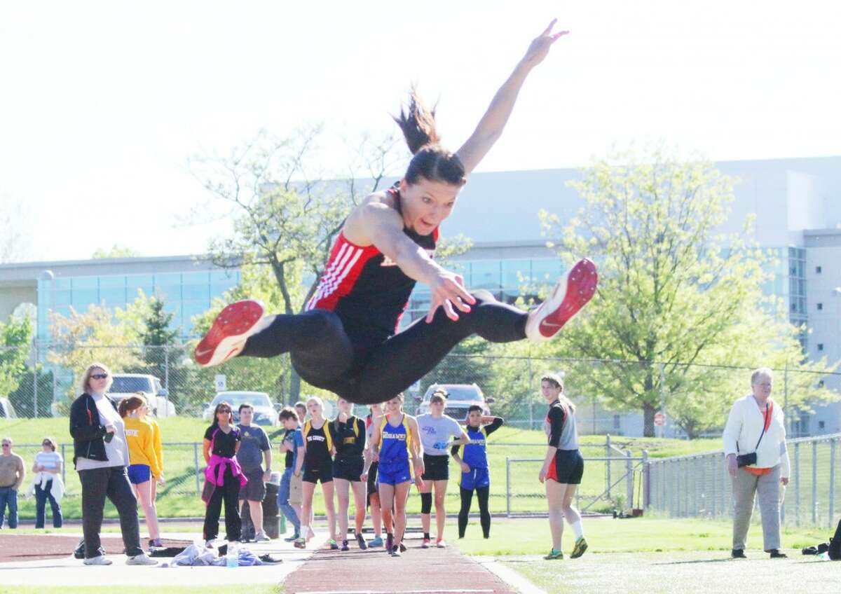Four time winner: SamiMichell gives it her best shot at the Pioneer meet in the pole vault. (Herald Review/Martin Slagter)