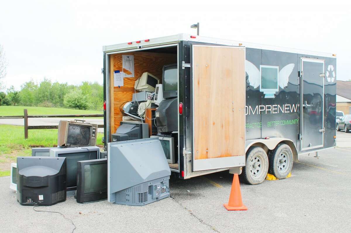 Proper disposal: Broken televisions and other electronics overflow from a Comprenew trailer sitting at Pine River High School. The school and community members participated in an electronic waste recycling drive and filled almost two large trailers. (Courtesy photo)
