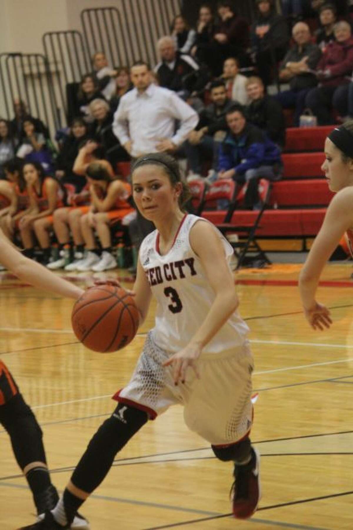 Kamryn Myers goes to the hoop for Reed City.