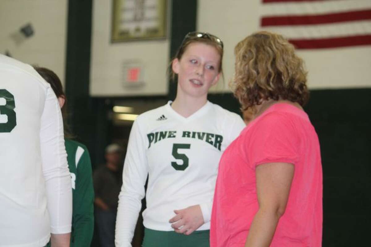 KayLee Goodman of Pine River confers with coach Jana Dennis.