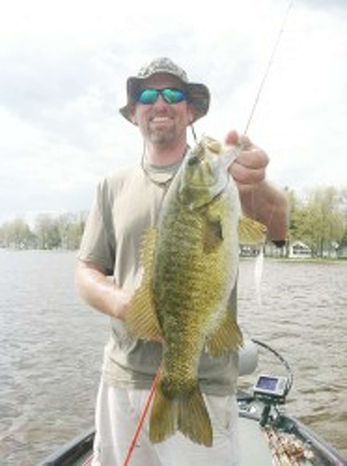 Bass Tournamnet: Tim Johns shows one of the fruits of his fishing labors. (Courtesy photo)