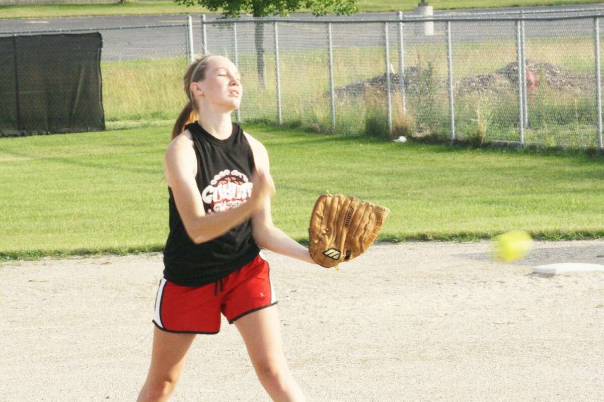 Summer practice: Skiler Brigham works on her pitching during a Reed City practice. (Herald Review/John Raffel)