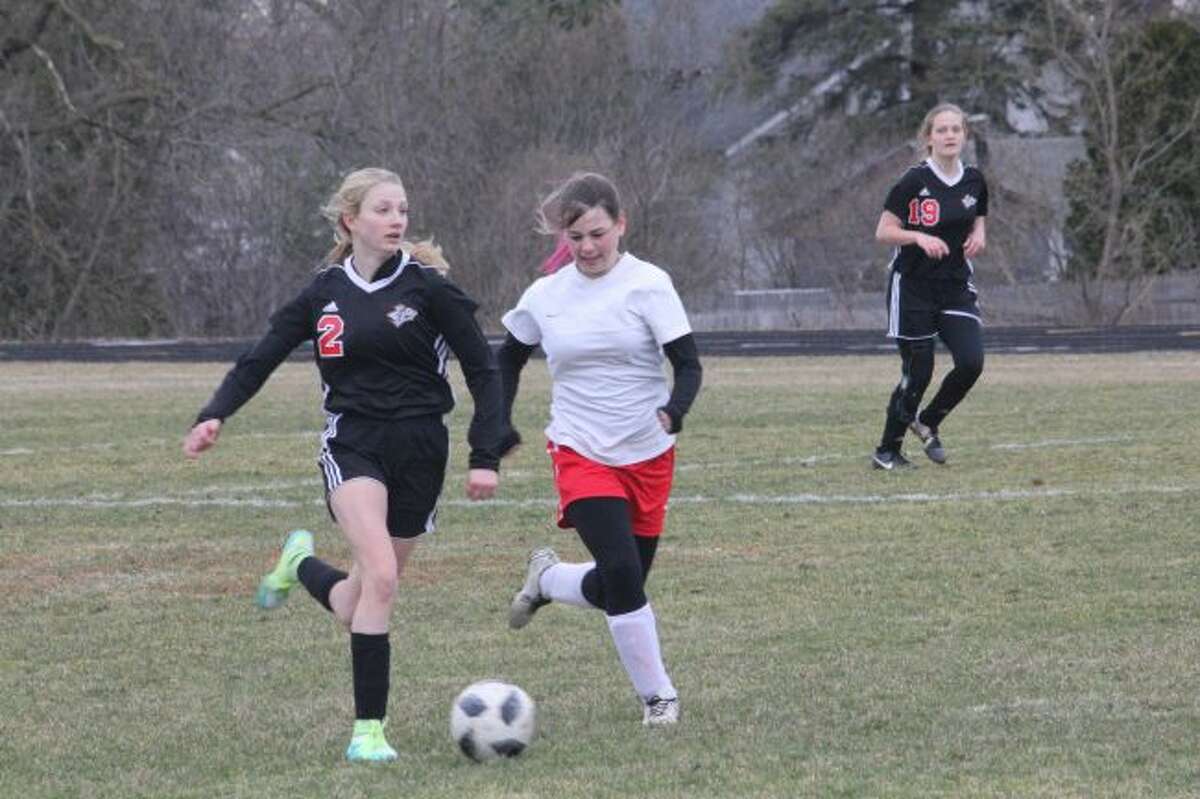 Karlie Kearns takes care of the ball against Kent City.
