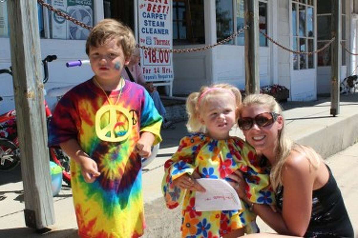 Hunter Shelton, 4, and Morgan Wanstead, 2, were chosen on Friday as the LeRoy prince and princess during Razzasque Days, which took place through Saturday in the village. Wanstead's proud mother, Melissa, joined in the photo. (Herald Review photo/Karin Armbruster)