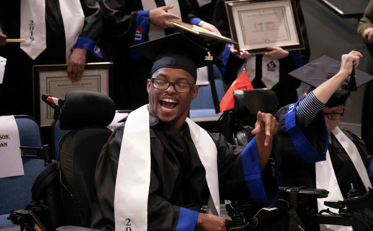A graduate reacts with joy at receiving his certificate from the UHD-HEART Program on Friday, Aug. 16, at the University of Houston Downtown. The three-semester program is designed to give adults with intellectual and/or developmental disabilities better educational, life and job opportunities.