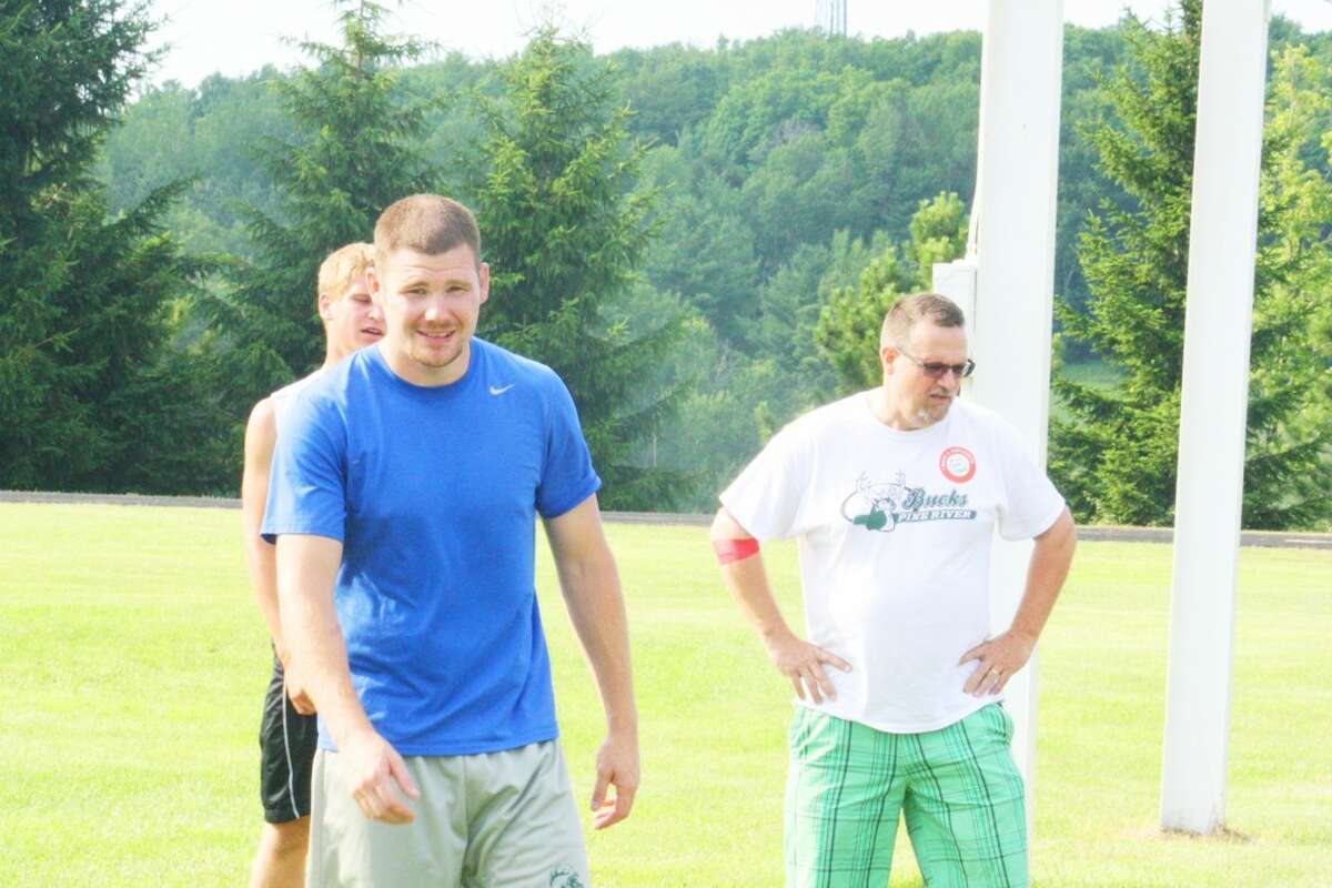 Football: Pine River football coach Terry Martin supervises a conditioning workout last week. (Herald Review/John Raffel)