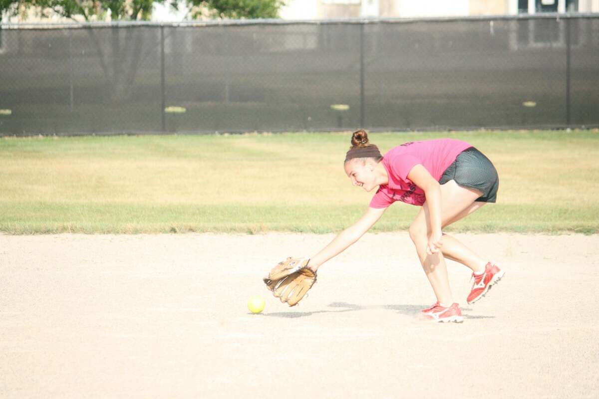 Softball: Olivia Lawson goes after the ball Sunday in a Reed City practice. (Herald Review/John Raffel)