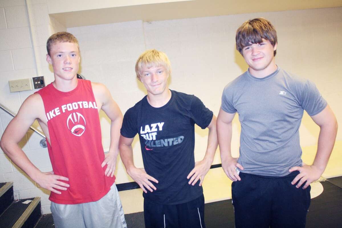wrestlers: From left, Devyn Ward, Thayne Stieg and Dylan Chrispell get ready for a summer wrestling workout at Reed City. (Herald Review/John Raffel)