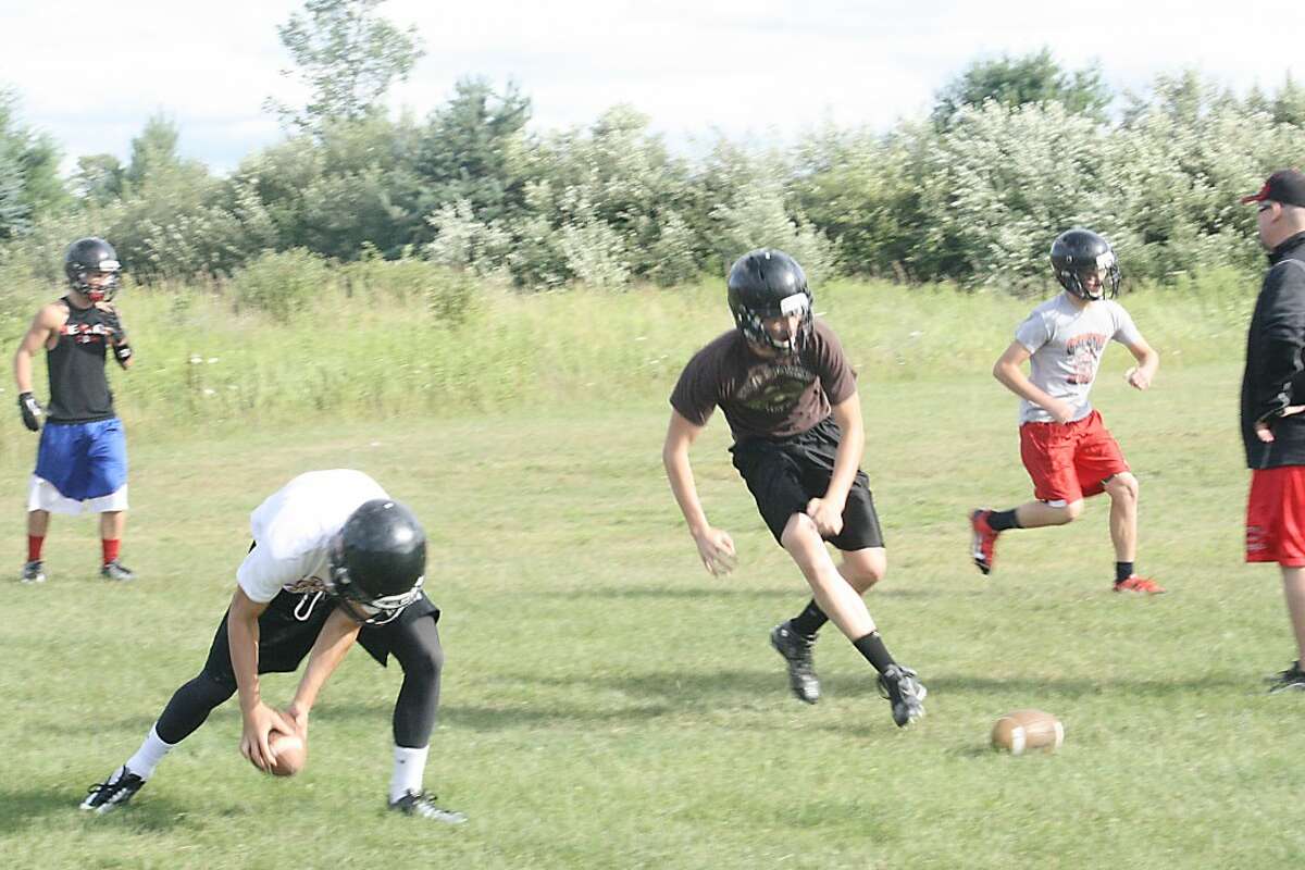 football practice: Reed City football players go after the ball during skills camp this week. (Herald Review/John Raffel)
