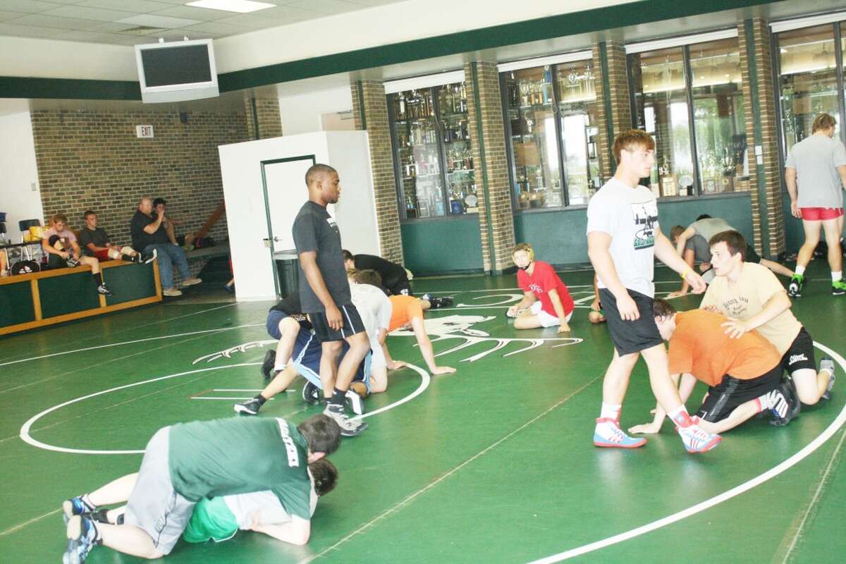 Wrestling camp: Michigan State wrestlers supervise the action last week during the Pine River Summer Camp. (Herald Review/John Raffel)
