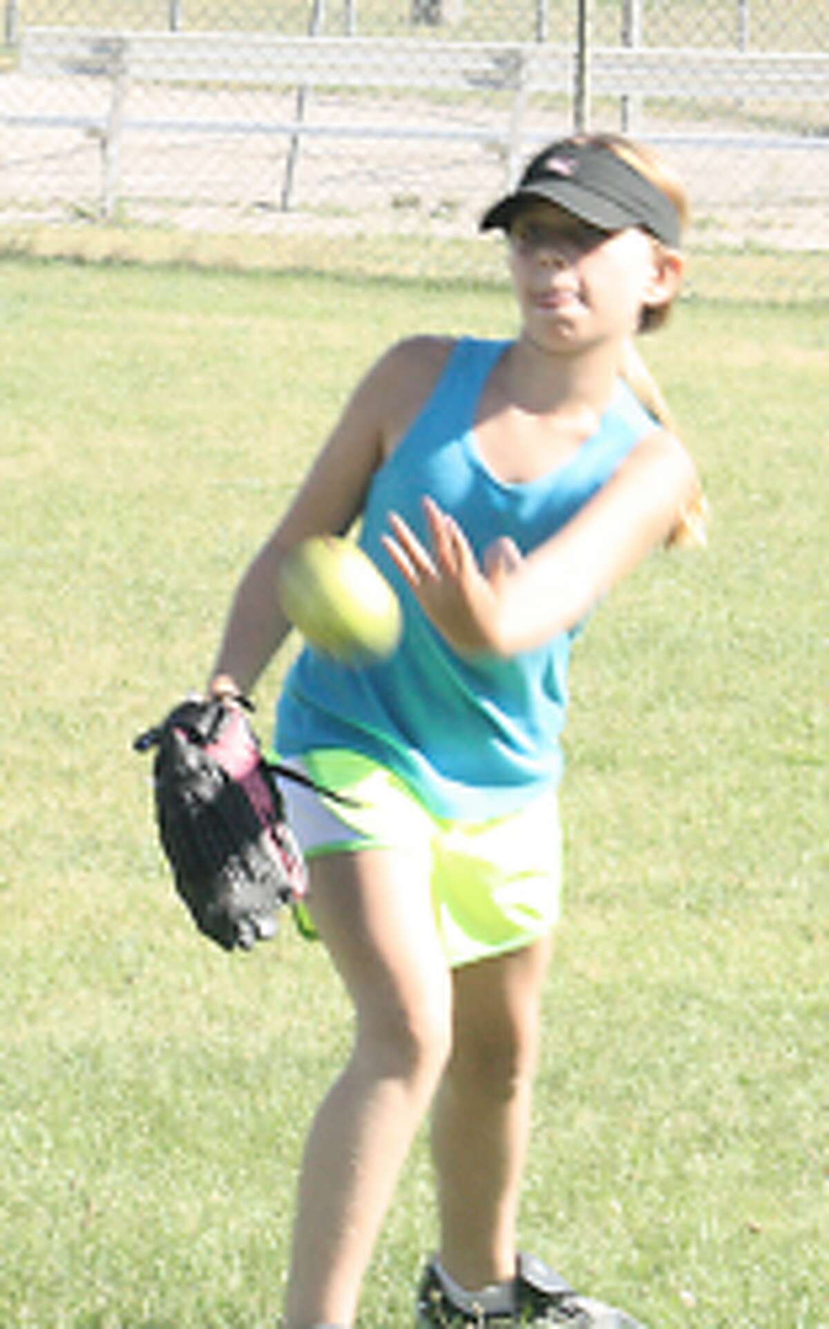 Softball: Josie Hoppes of Reed City-Evart works on her pitching during a practice last week. (Herald Review/John Raffel)