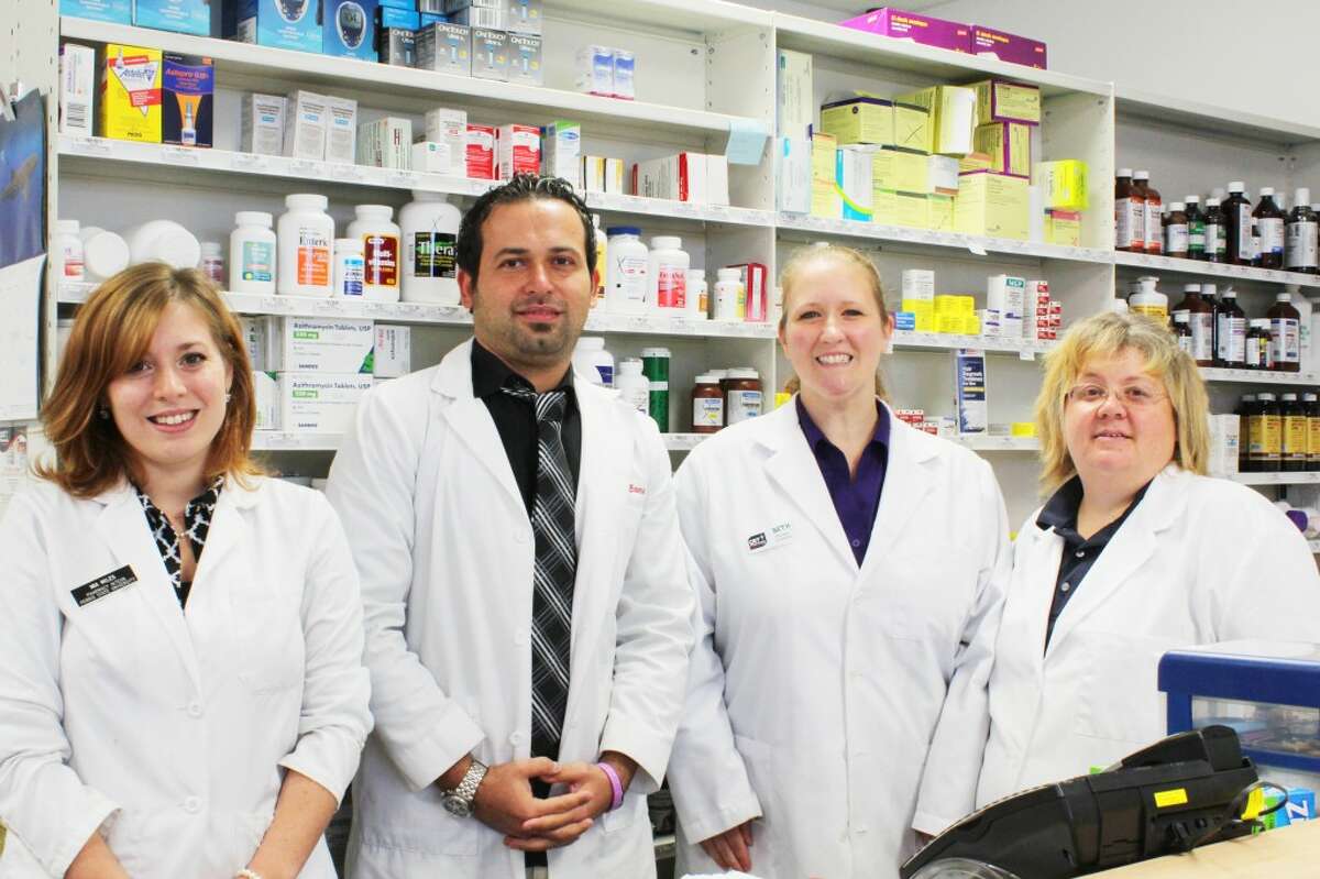 Excellent staff: CET Pharmacy staff members (from left) Mia Miles, Dr. Mike Basma, Beth Sweney and Jodi Sayer make sure to create personal relationships with customers while providing fast service. The pharmacy is located at 204 N. Patterson Road next to Spectrum Health Reed City Hospital. (Herald Review photo/Karin Armbruster)