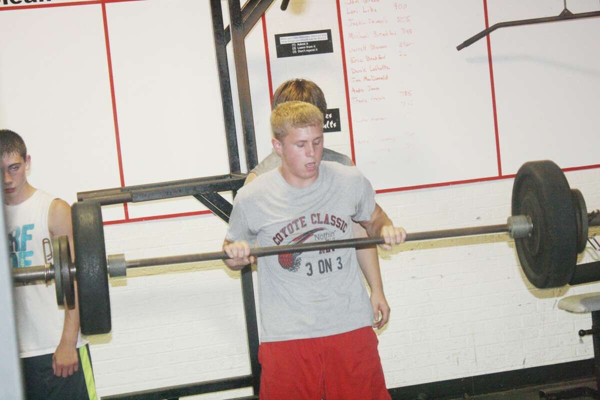 lifting: Reed City football players were busy in the weight room last Thursday. (Herald Review/John Raffel)