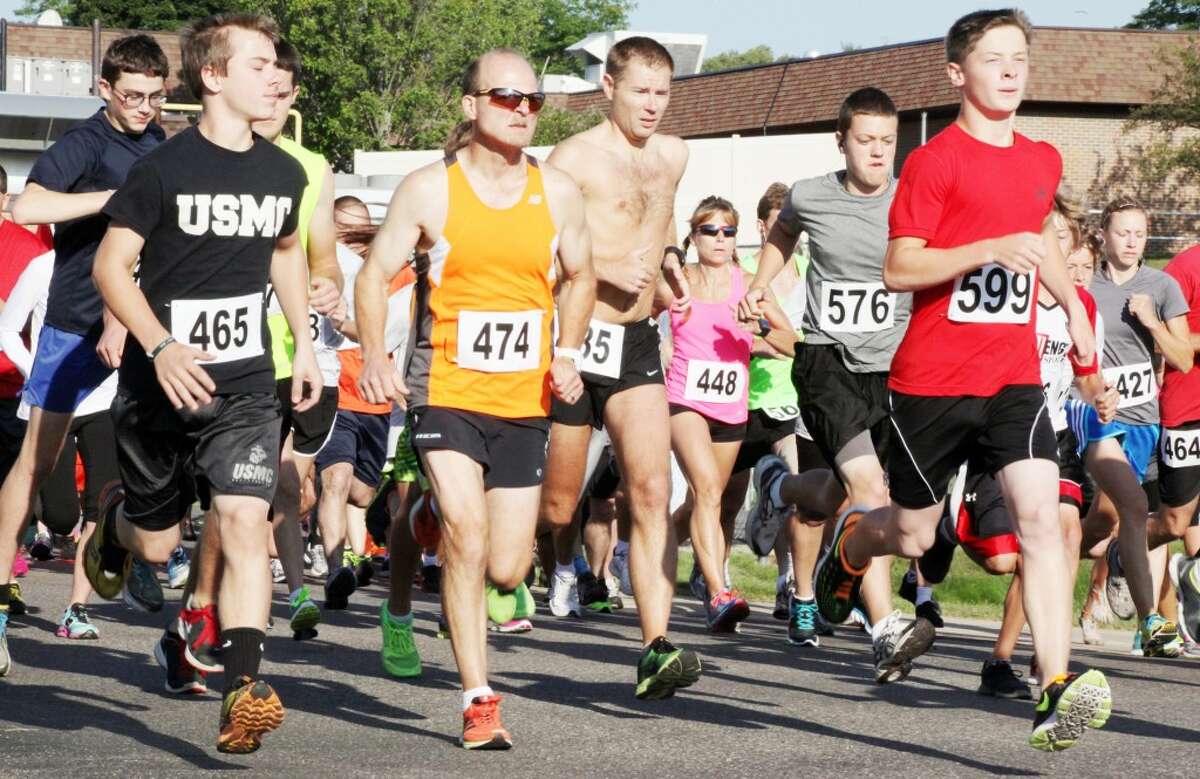 Runners in the Spectrum Health Reed City Hospital 5K take off as part of the Crossroads Festival celebration on Saturday. (Pioneer photos/Martin Slagter)