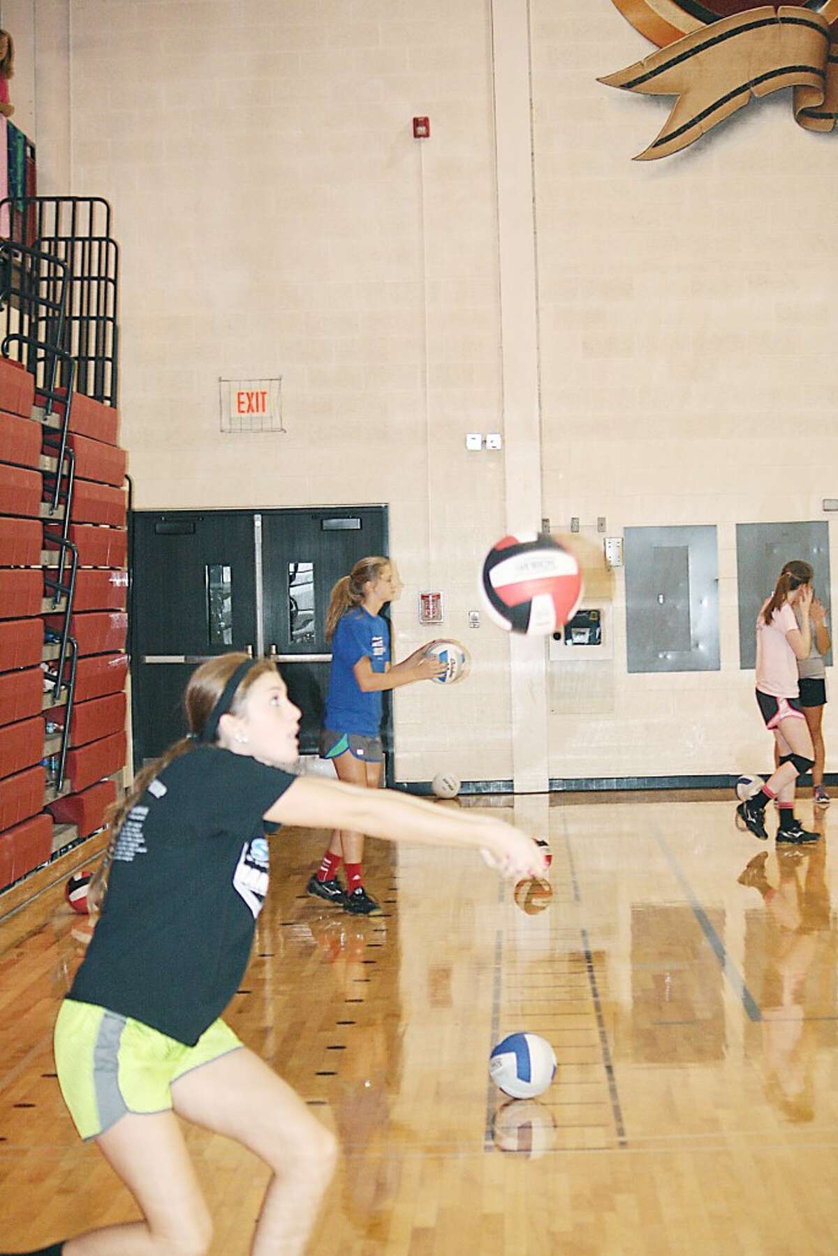 PRACTICE: Alaina Woodard works on her passing during a Monday Reed City volleyball practice. (Herald Review/John Raffel)