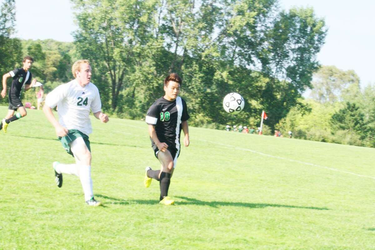 Luke Harris (24) of Pine River goes after the ball against Houghton Lake. (Herald Review/John Raffel)