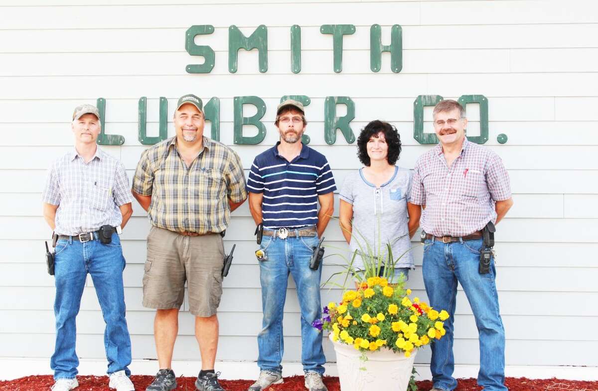 A long history: Smith Lumber Co. in Evart is a business that has a history of more than 100 years offering lumber, hardware, tools, cleaning supplies and other products to help customers complete a number of home and property projects. Staff members (from left) Brent Henry, Jeff Storch, Raymond Crawford and owners RaeMarie and Alan Salinas are available to assist with their expertise. (Herald Review photo/Karin Armbruster)