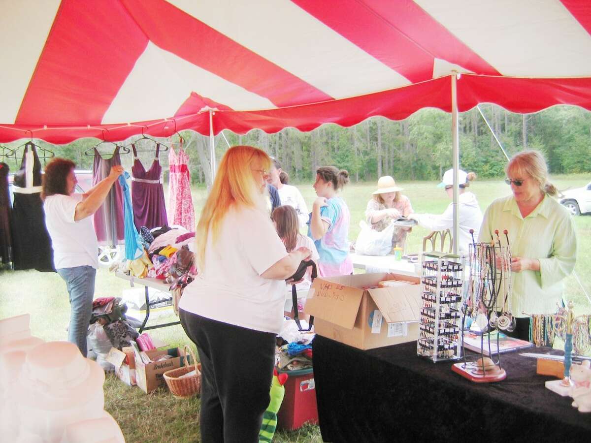 sale: Members of the Osceola League for Arts and Humanities hosted its annual Labor Day yard sale on Saturday and Sunday in Evart. Shoppers enjoyed browsing through practical everyday items and a wide variety of toys, books, games, clothing, linens, craft supplies, jewelry, pottery, furniture, figurines and collectibles. (Herald Review photo/Randy Johnston)