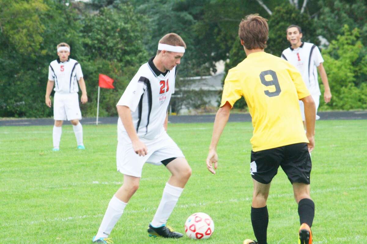 Reed City's Andrew Booth (21) goes after the ball against Tri County last week. (Herald Review/John Raffel)