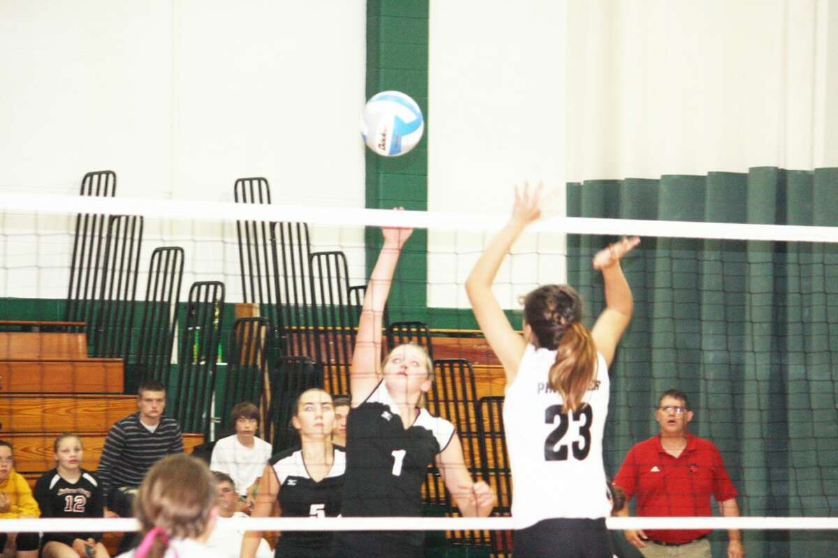 Michaela Reed (1) of Reed City goes after the ball against Pine River's Kyla Johnson (23). (Herald Review/John Raffel)