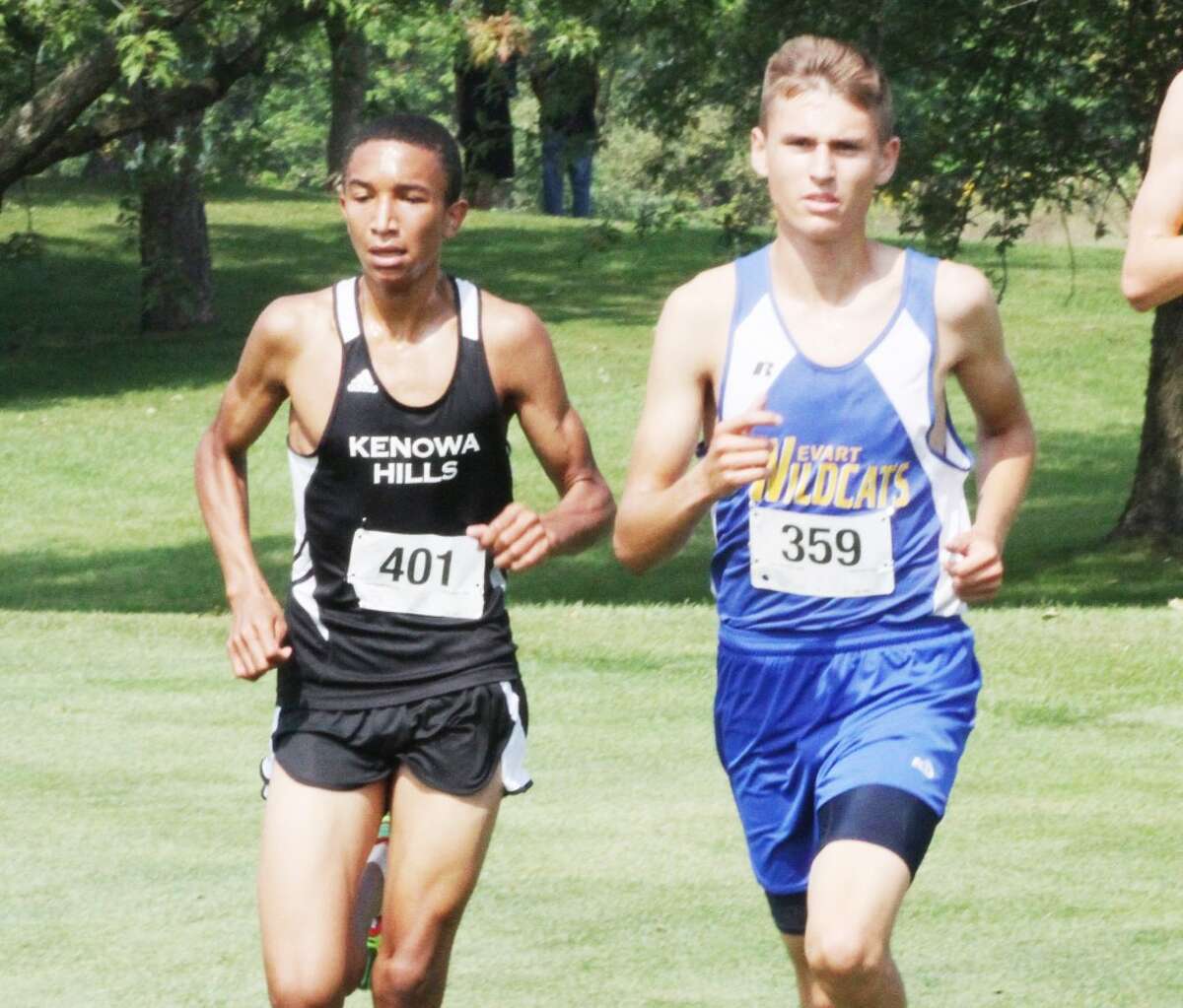 Max Hodges (right) of Evart works his way through the course at Ferris on Saturday. (Herald Review/Martin Slagter)