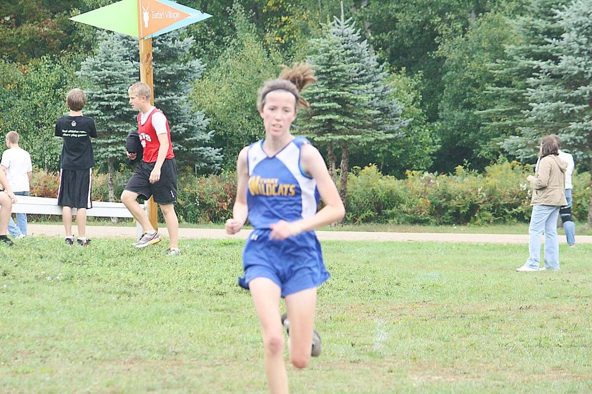 FInish line: Evart's Grace Hamilton heads to the finish line against Reed City last Friday. (Herald Review/John Raffel)