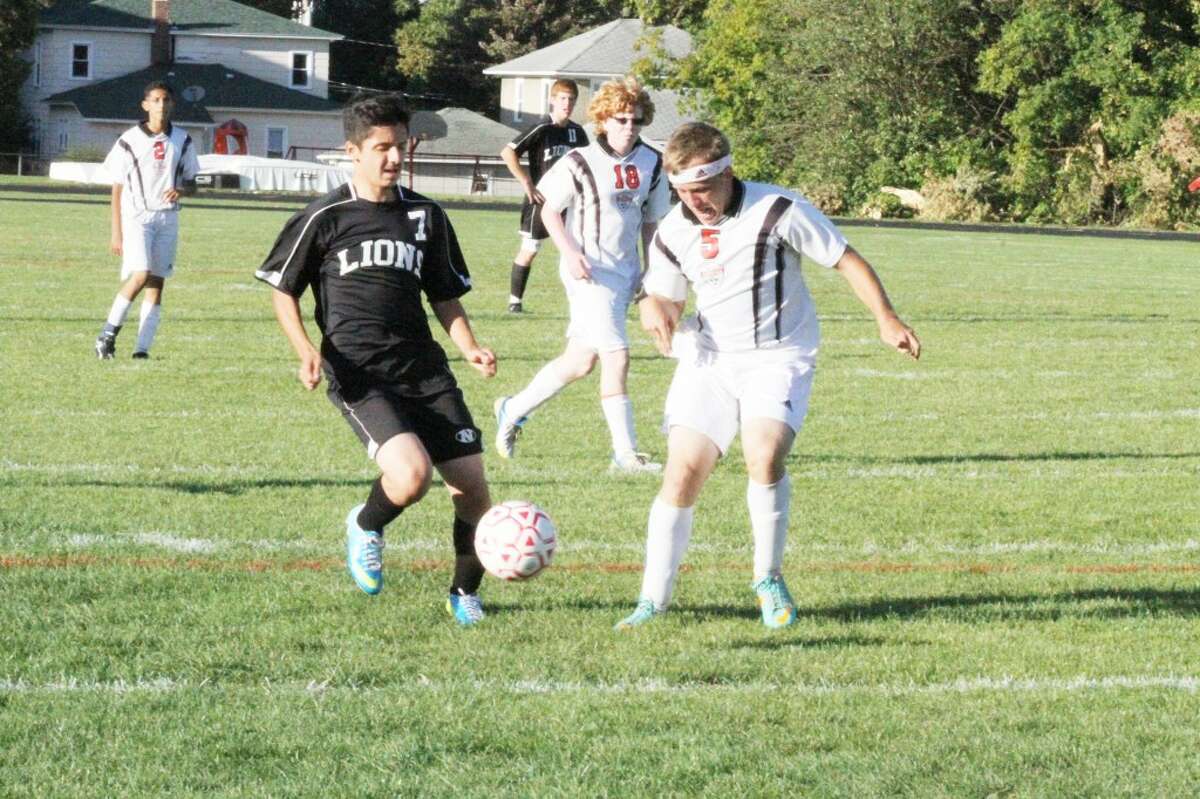 MATCH: Reed City soccer junior Dylan Langlois (5) plays the ball against Newaygo last week. (Herald Review photo/Martin Slagter)