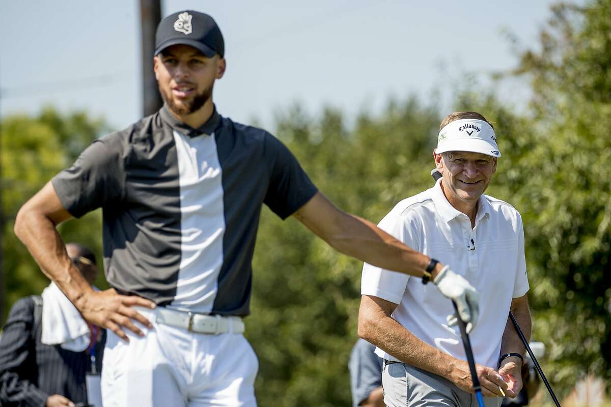 Golden State Warriors guard Stephen Curry, center, stands with Callaway Golf Company CEO Oliver Brewer III, center right, before teeing off at Langston Golf Course in Washington, Monday, Aug. 19, 2019, after Curry announced that he would be sponsoring the creation of men's and women's golf teams at Howard University. (AP Photo/Andrew Harnik)