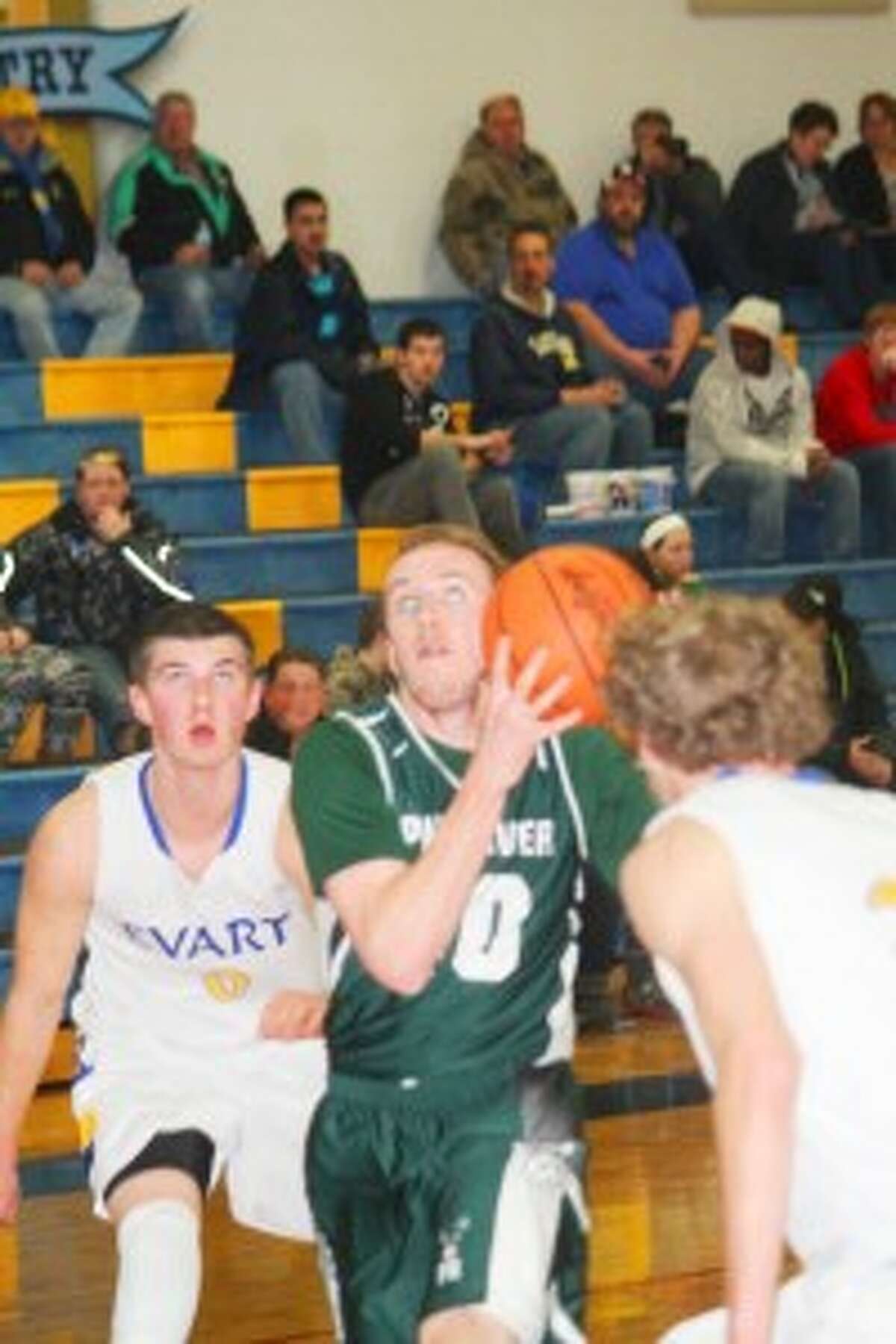 Season: Pine River's Lucas Harris attacks the basket against Evart. (Herald Review photo/John Raffel)