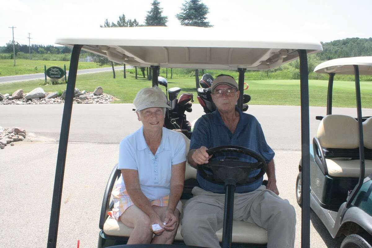 TEEING OFF: Marge and Jerry Selbee, of Evart, get ready for another day of action in the Tustin Trails Golf Course couples league. (Herald Review photo/John Raffel)
