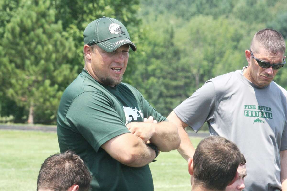 SCRIMMAGE: Chad Phillips, Pine River football coach, talks with his players after Saturday's 7-on-7 scrimmage. (Herald Review photo/John Raffel)