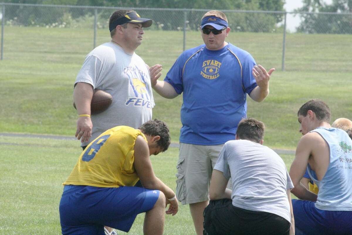 GAME PLAN: Coach Pat Craven chats with his football team after Saturday’s Pine River 7-on-7 passing tournament. (Herald Review photo/John Raffel)