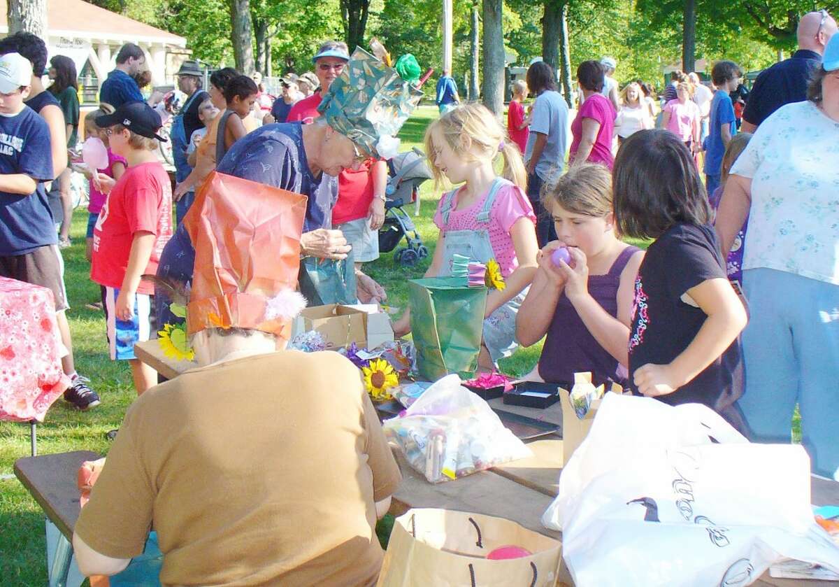 BLOCK PARTY: National Night Out is an event to make the community safer through strengthening bonds between law enforcement and the community. The sixth annual event will be held from 6 to 8 p.m. on Aug. 7 at Riverside Park in Evart. (Herald Review file photos)