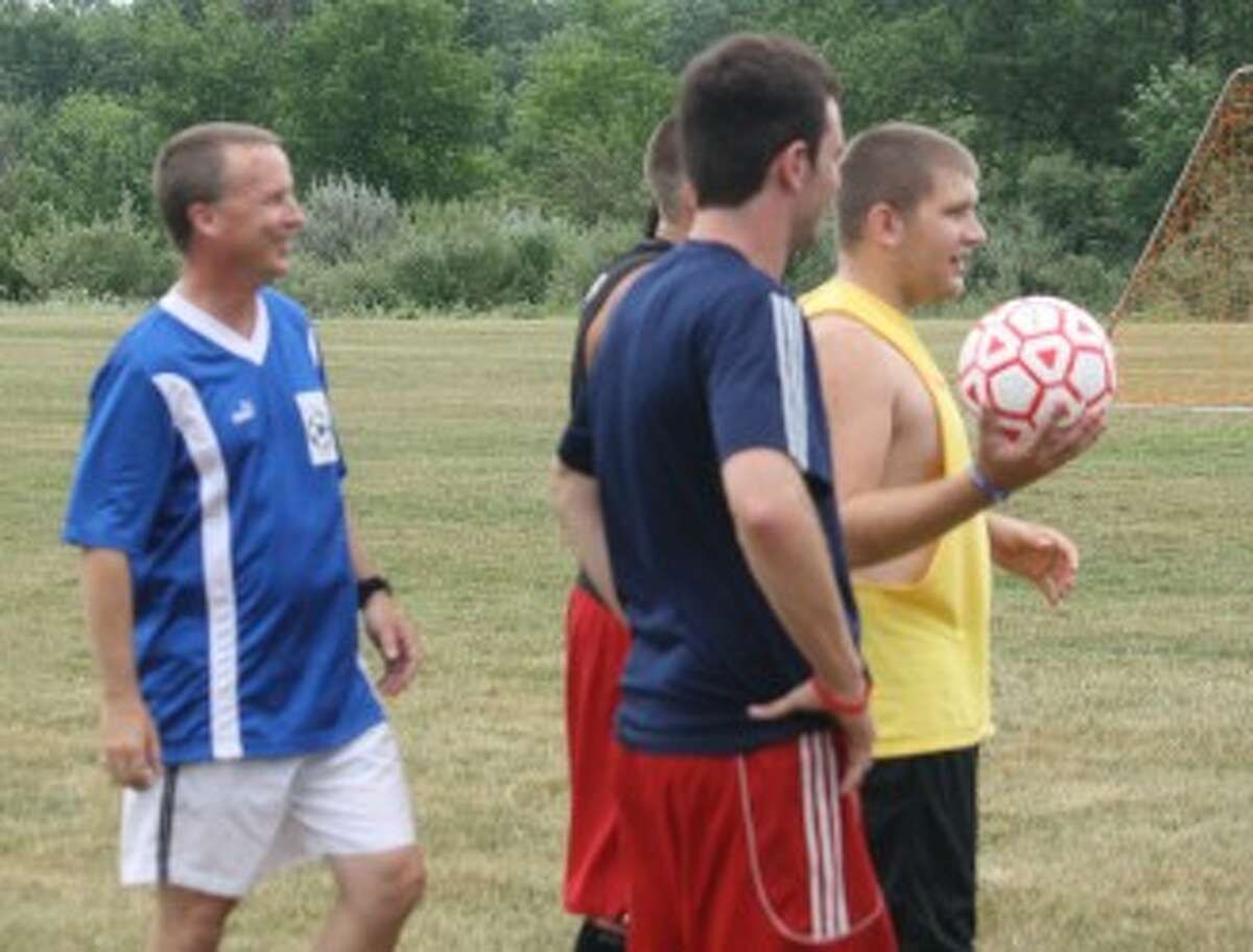 LOOKING THINGS OVER: Reed City soccer coach Dave Mix keeps an eye on the action during a practice last week. (Pioneer photo/John Raffel)