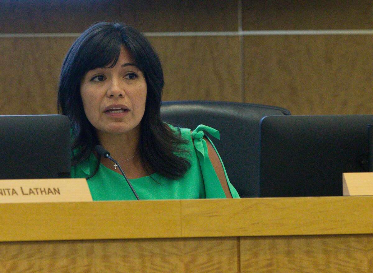 In this April file photo, Houston ISD Board President Diana Dávila gives credits to students who travel extra distance to attend High School Ahead Academy during a discussion of the alternative school during a monthly board meeting.