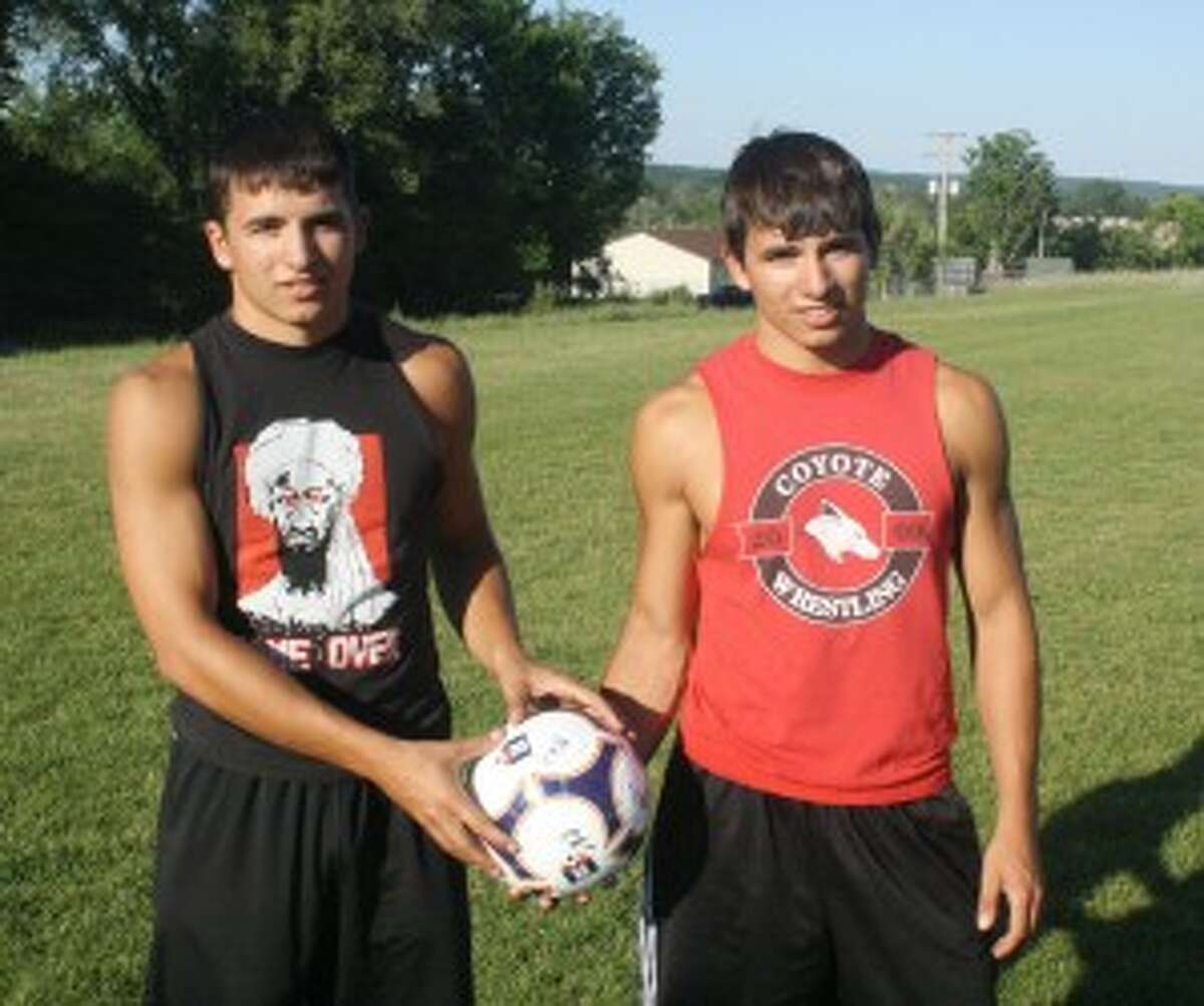 DOUBLE DOSE: Eric, left, and Kyle Voelker get ready for their next soccer practice. (Pioneer photo/John Raffel)
