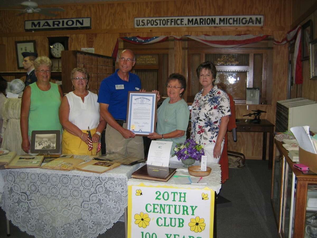 Club members celebrate 100 years of history. Left to right: Beverly Orvis Sharon Cutler, Rep. Johnson, club president Carolyn Ahrens, Sue Weisburg. (Herald Review photo/Randy Johnston)