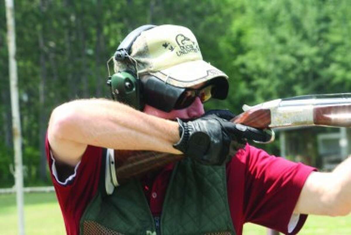 READY, AIM: Todd Dew takes aim at a target at the Reed City Sportsman Club. (Herald Review photo/John Raffel)
