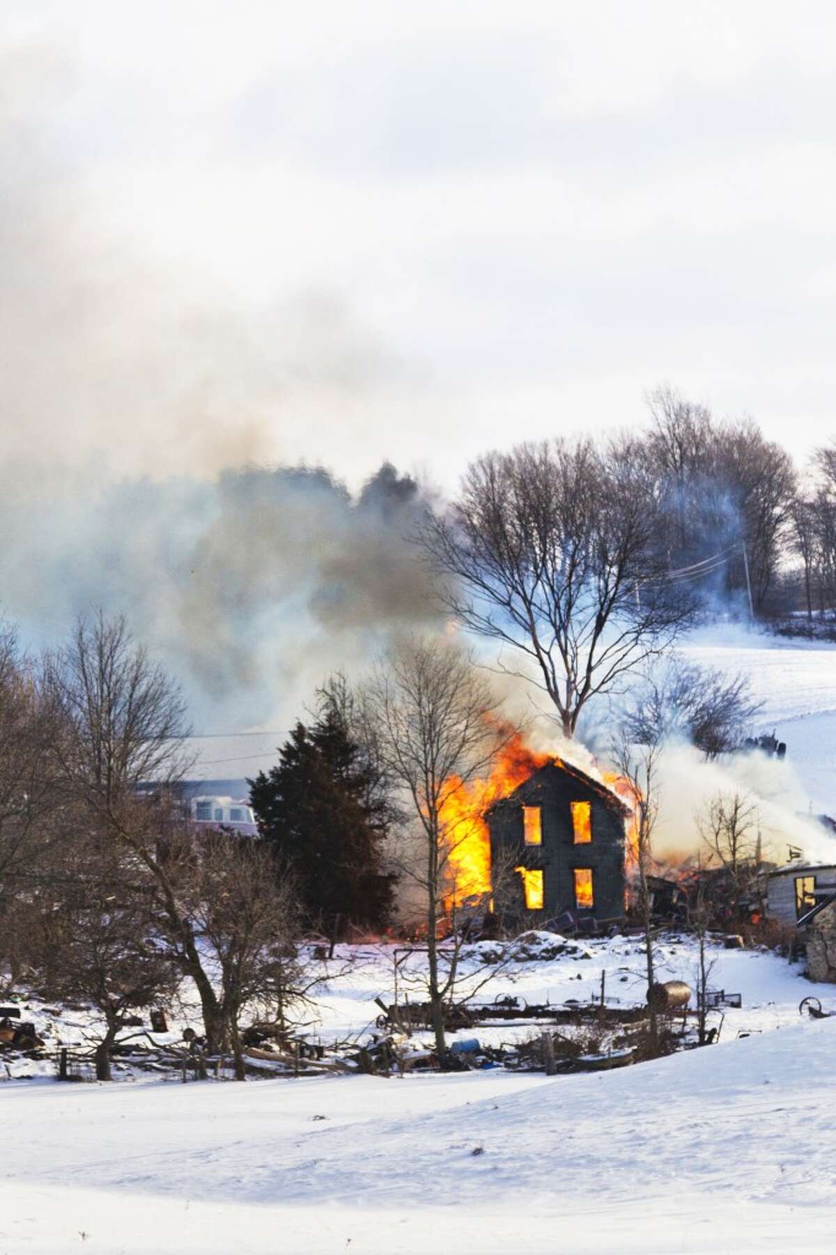 HOUSE DESTROYED: The fire began around 9 a.m. and spread from a wood stove. (Herald Review photo/Justin McKee)