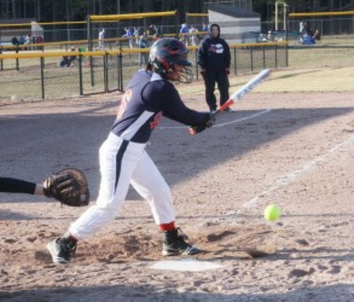 CONTACT: Big Rapids' Kelly Taylor makes contact with a pitch during Wednesday's doubleheader against Evart. (Pioneer photo/John Raffel)