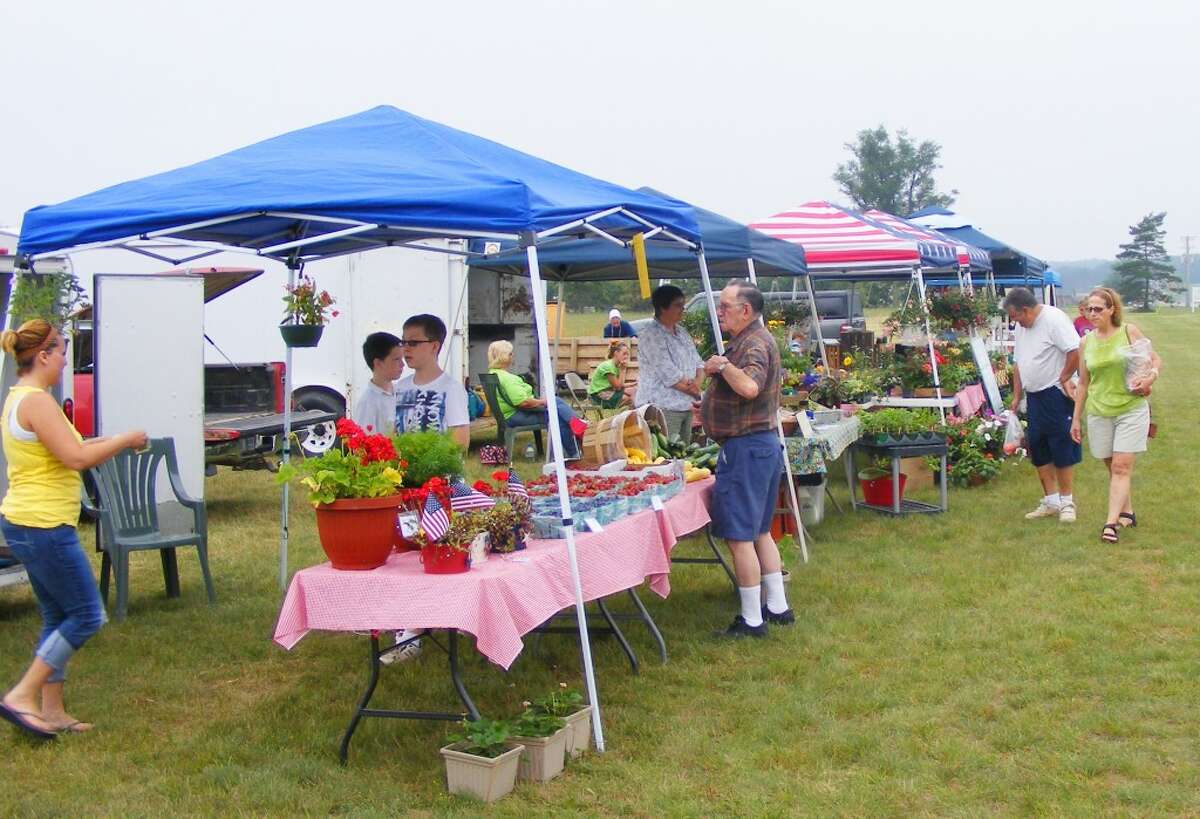 Local economies: Last year, thousands flocked to their local farmers markets to buy local food, plants and other products, while generating millions in state revenue. (File photo)
