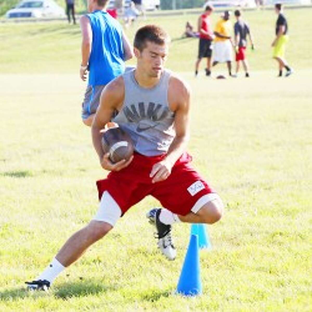 Football: Chad Samuels of Reed City goes through a drill. (Pioneer/Greg Buckner)