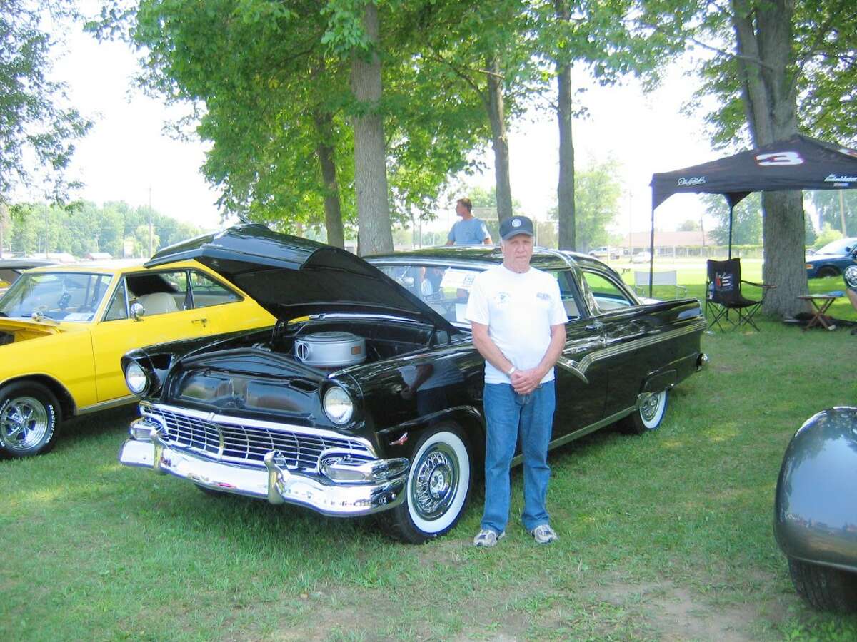 Classic cars: Tom Leski from Elmira poses with his 1956 Ford Crown Victoria at last year's Marion Days Car Show. This year, Marion Days will take place from Aug. 1 through Aug. 3 and offer a number of events for all ages, including parades, tractor pulls, a golf scramble, softball tournaments, bounce houses and more. (Herald Review file photo)