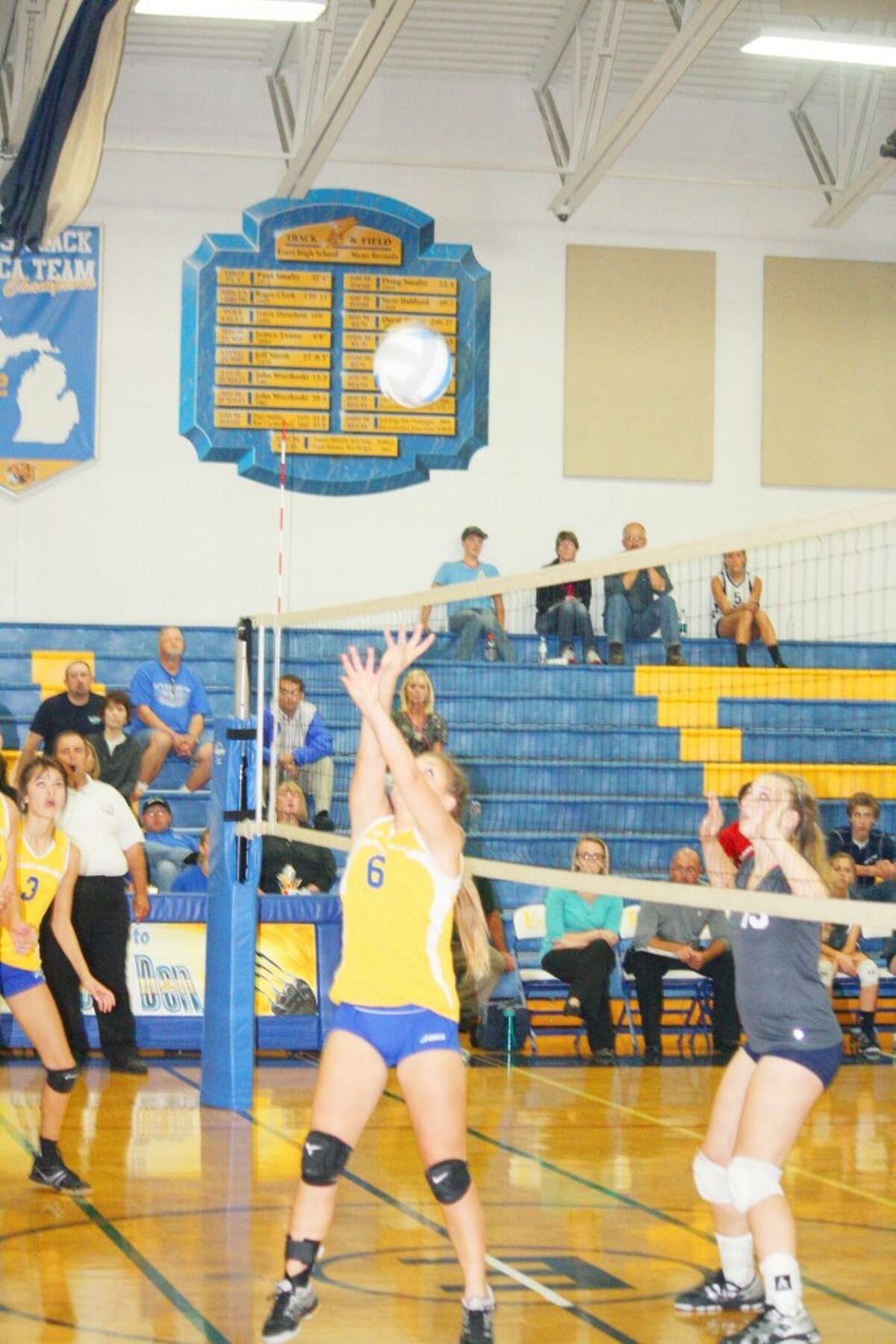 Tabby Turley (6) plays the ball for Evart in volleyball action last Thursday against Montabella. (Herald Review photo/John Raffel)