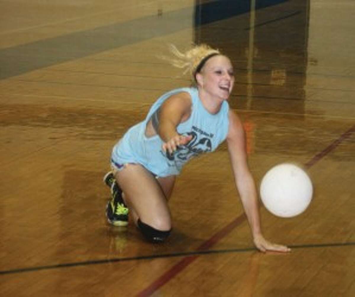 REACHING OUT: Saige Nabozny of Evart goes after the ball in a practice. (Herald Review photo/John Raffel)